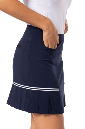 Side view of bestseller navy golf skort with cute white side trim and pleats and a hidden front tee pocket