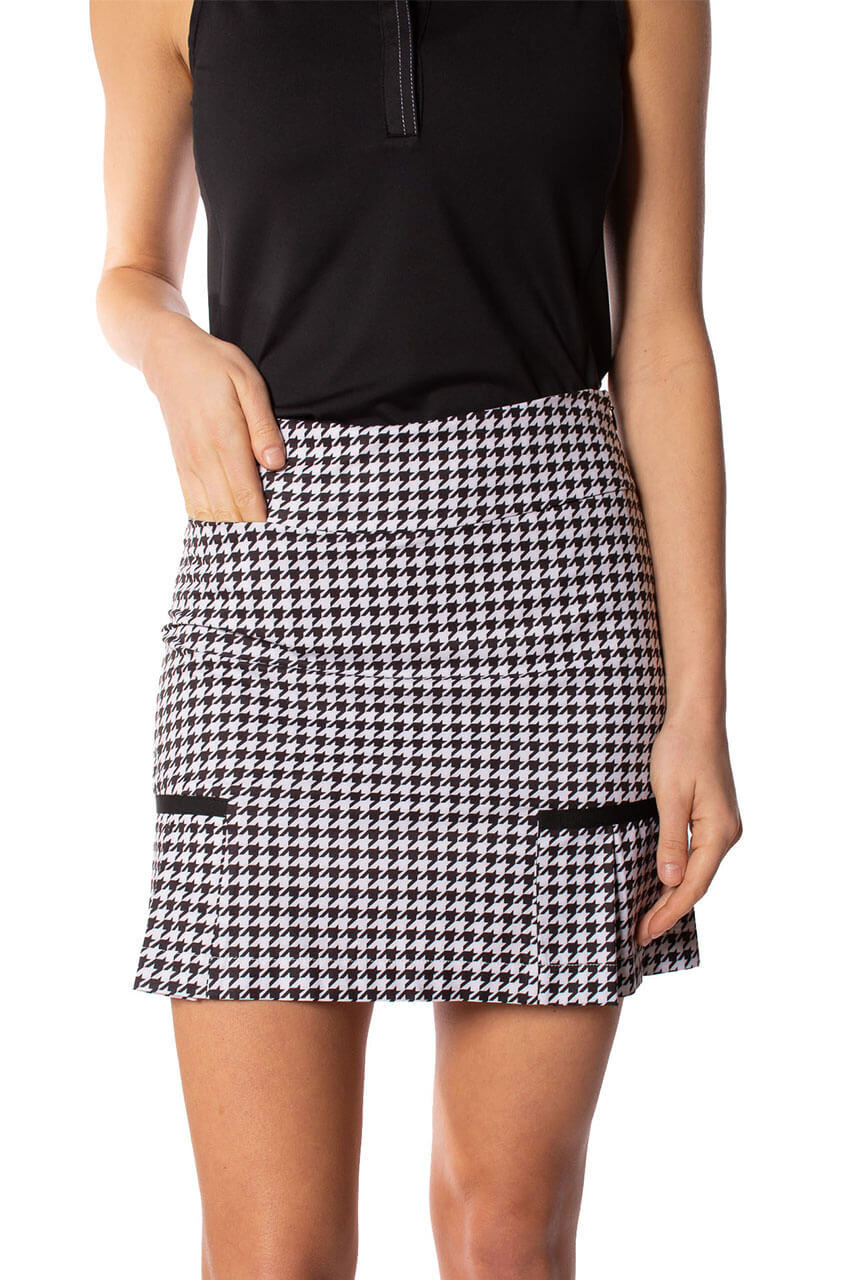 Women's black and white houndstooth print golf skort with black trim and a best selling design for golf and fashion