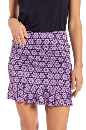 Women's lavender golf skort with hidden front tee pocket and matching navy top
