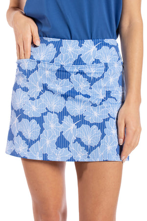 Shorter womans golf skirt in royal blue with sky blue flower pattern design