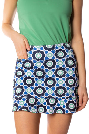 Shorter length cute blue and green golf skort with a ruffle trim and green polo