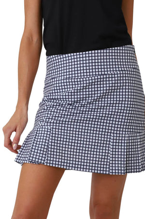 Women's bestseller golf skort in navy and white check gingham print and a navy matching top