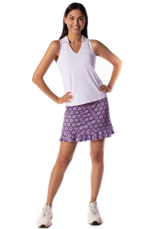 Women's lavender golf skort with white sleeveless sport polo
