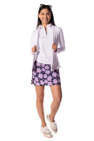Women wearing stylish athletic white zip sport jacket with matching lavender floral skirt