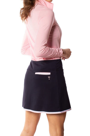 Women's navy skort with pink and white striped trim and matching sun protection long sleeve polo