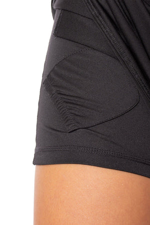 Hidden ball pocket on women's black skort for golf tennis pickleball and more