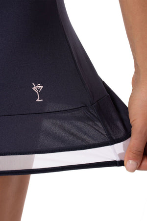 Navy and white golf skort with perfect stretch on mesh trim detail and a light pink martini logo from Golftini