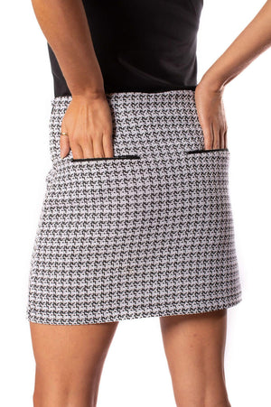 Black and white tweed stretch weaved skort with left and right rear pockets and a black shirt